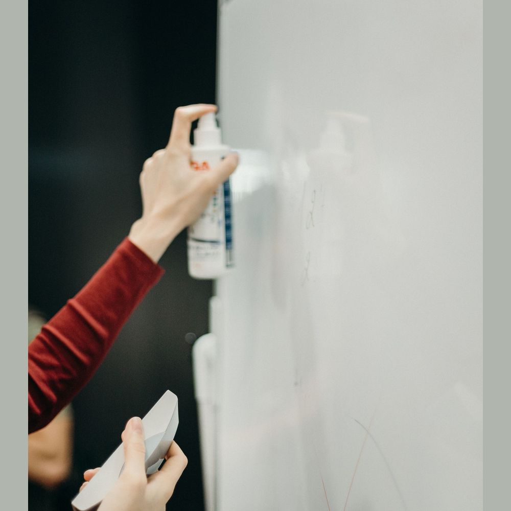 Dry erase surface being wiped clean