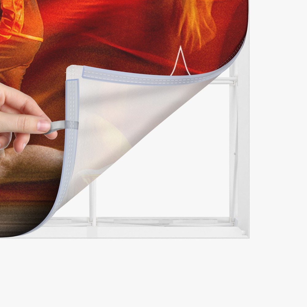 Silicone edge of the fabric graphic being pressed into the frame channel