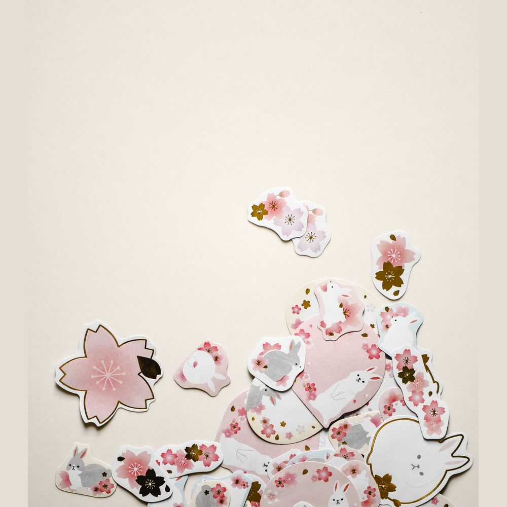 Die-cut paper stickers in cherry blossom shapes
