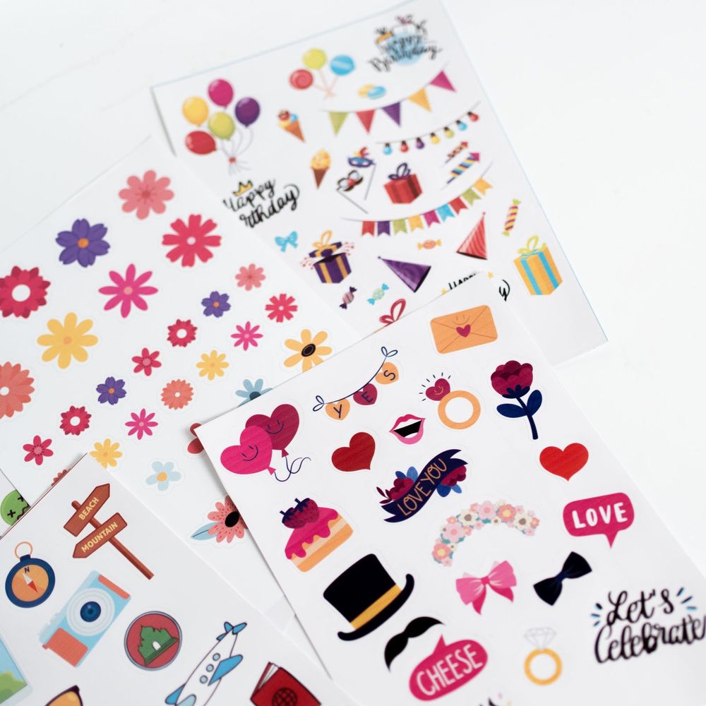 Kiss-cut paper sticker sheets with party and flower designs