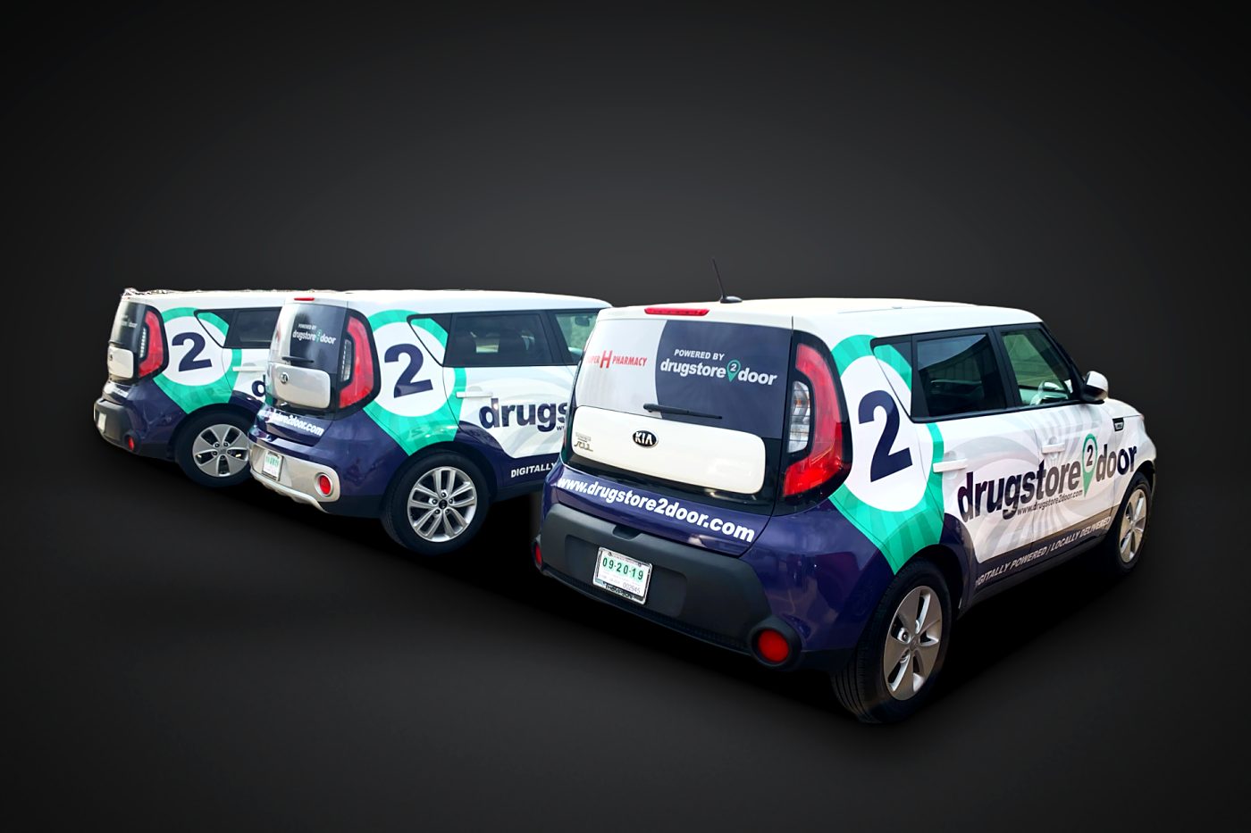 Matching fleet wraps on a row of Kia Soul cars