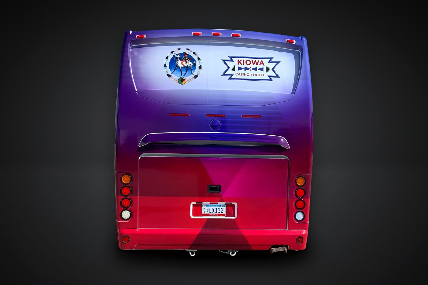 Rear of the Kiowa Tribe wrapped coach bus