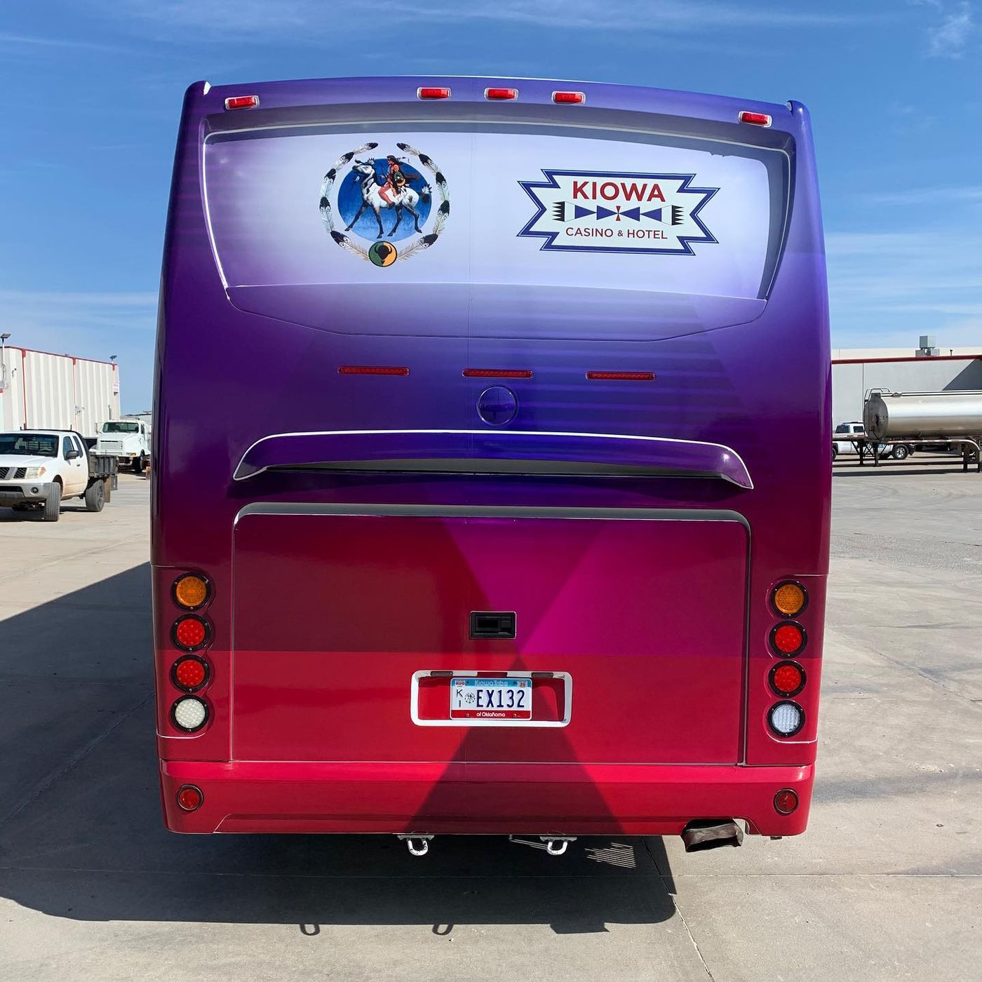 Rear of the Kiowa Tribe wrapped coach bus