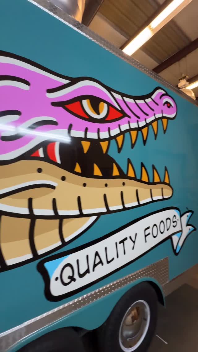 Quality Foods alligator food trailer wrap reel