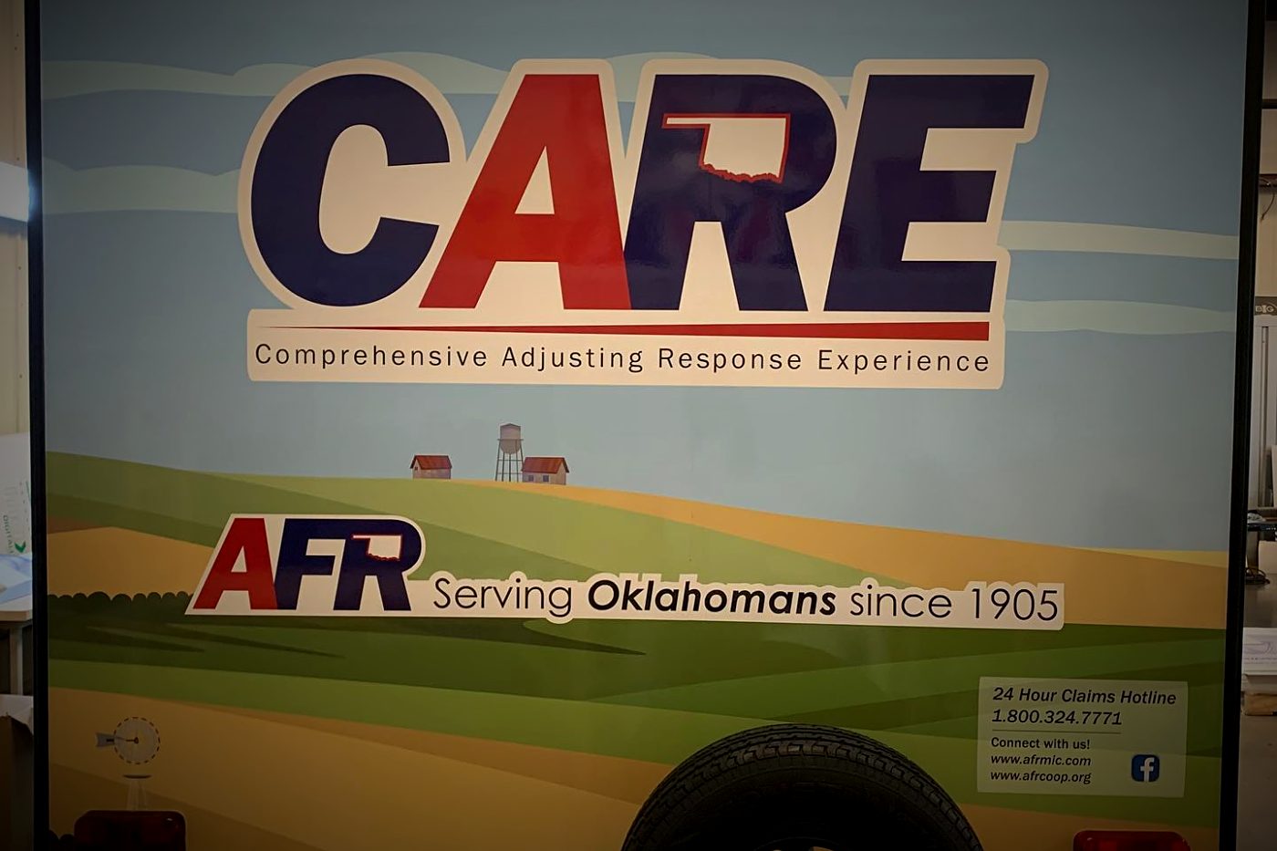 Rear of AFR CARE wrapped camper trailer