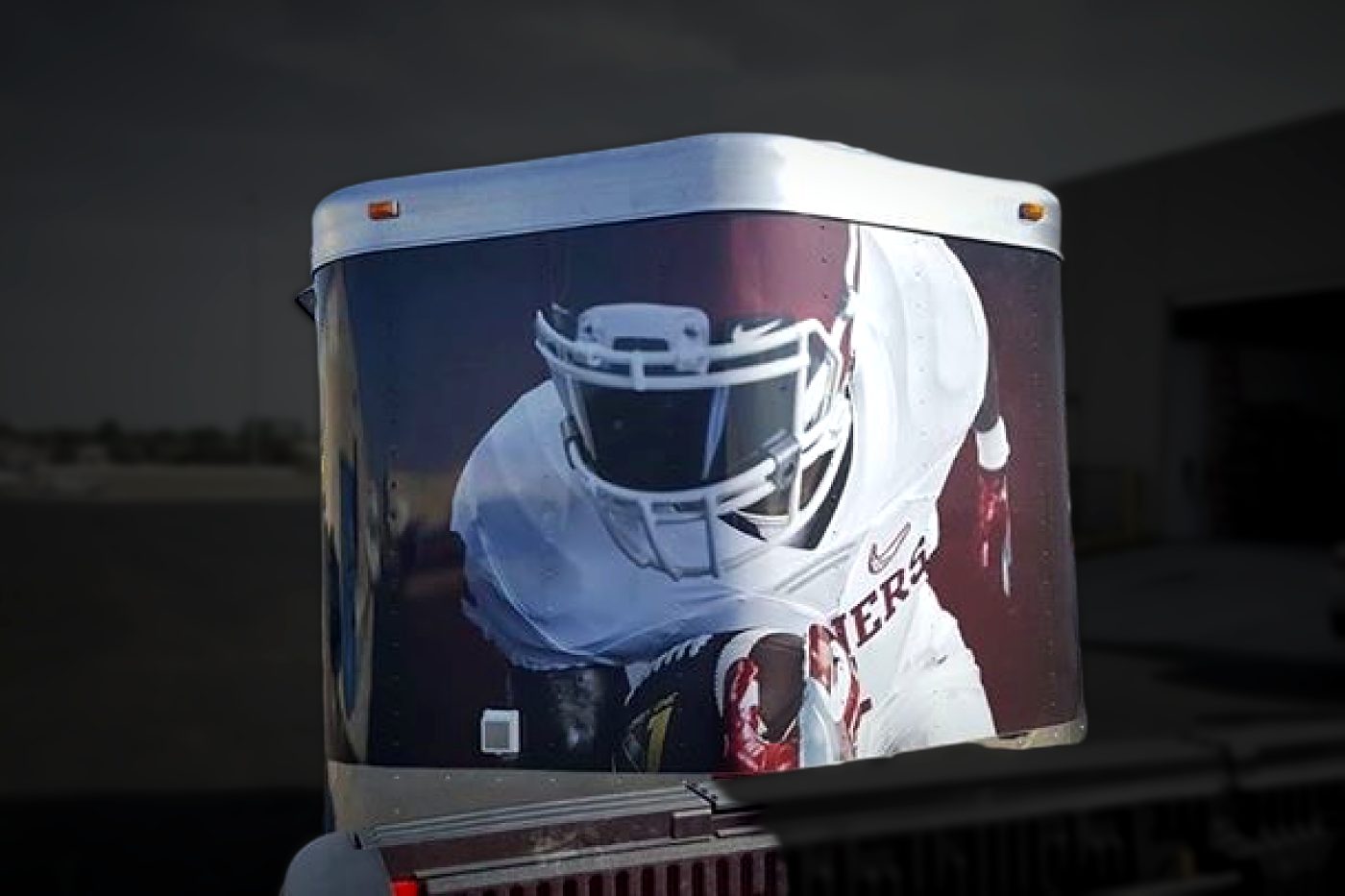 Oklahoma Sooners football player graphic wrapped on the rear of an enclosed trailer