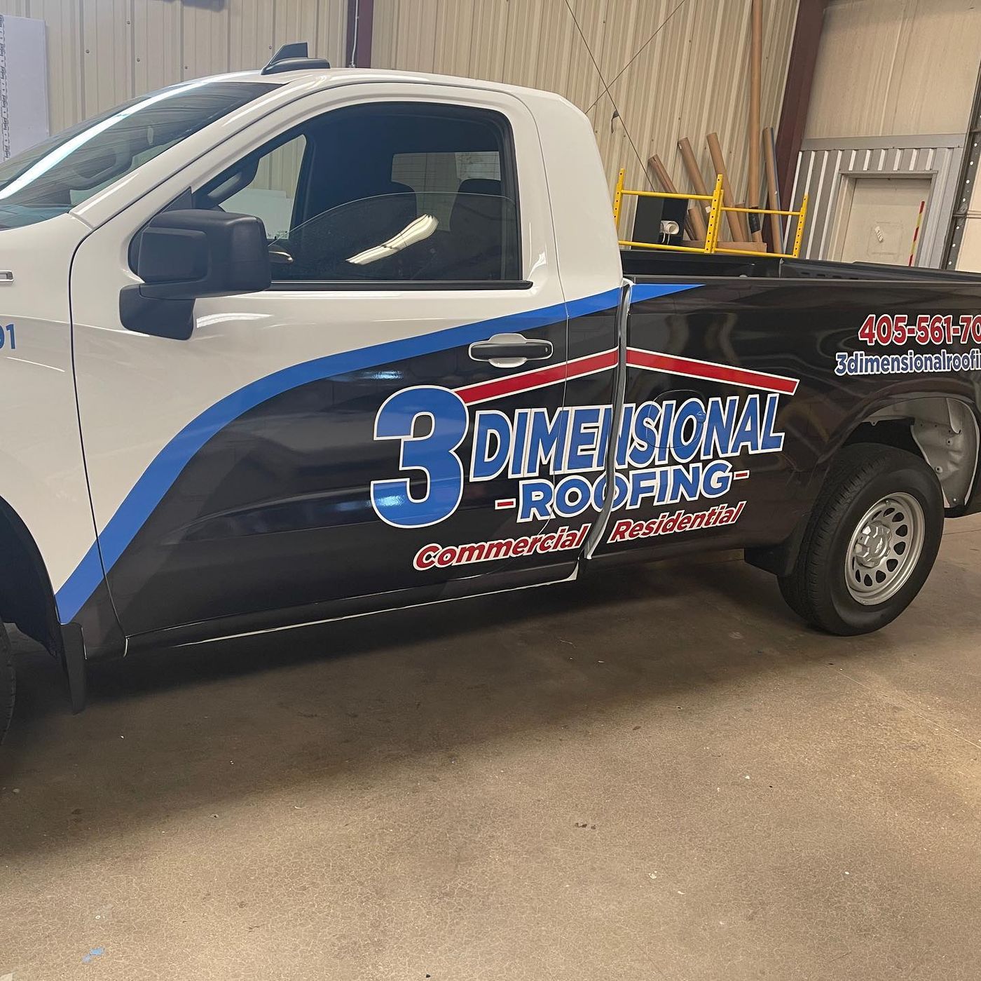 3 Dimensional Roofing graphics on a white pickup