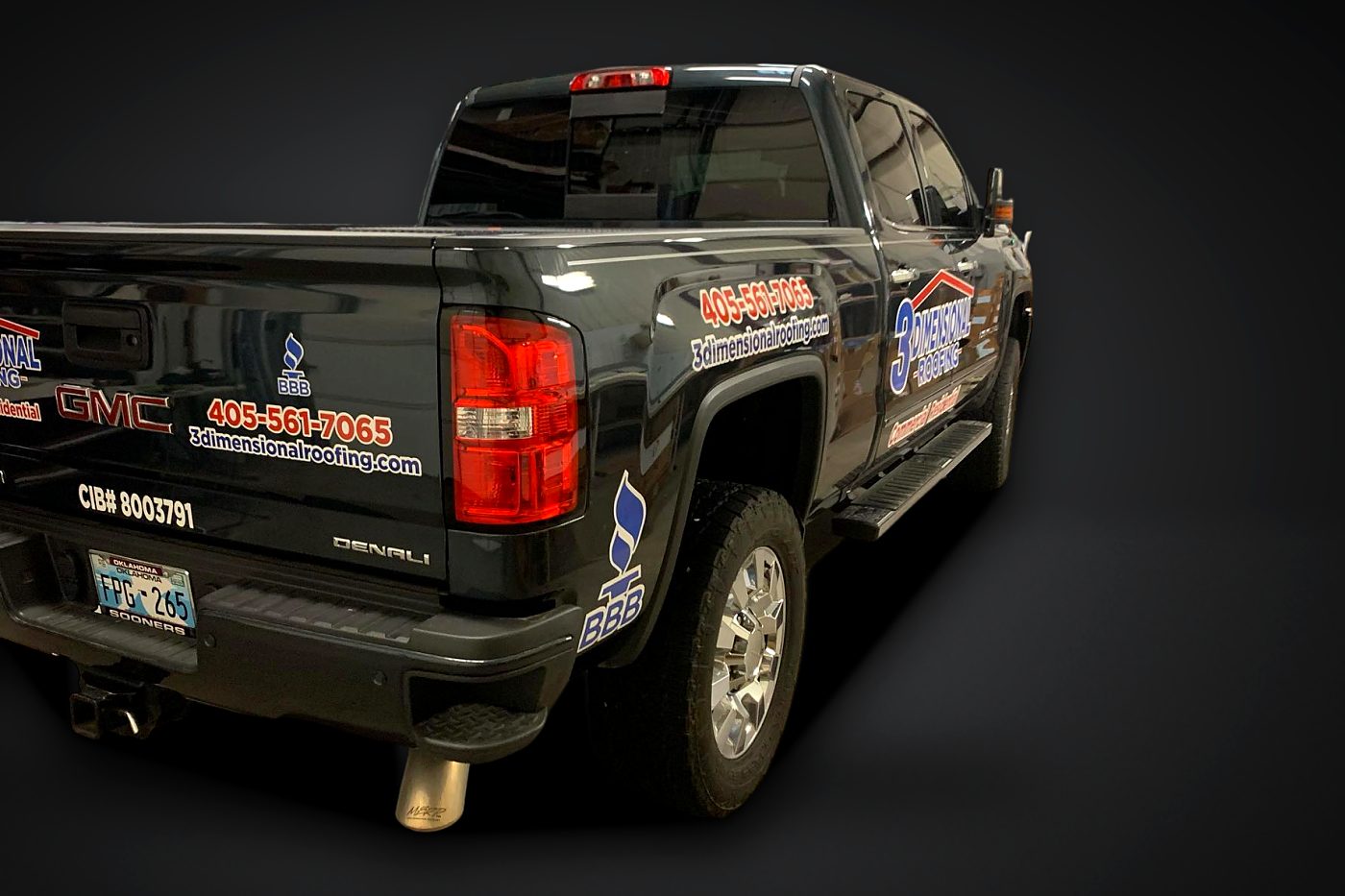 Door and tailgate graphics on a black pickup