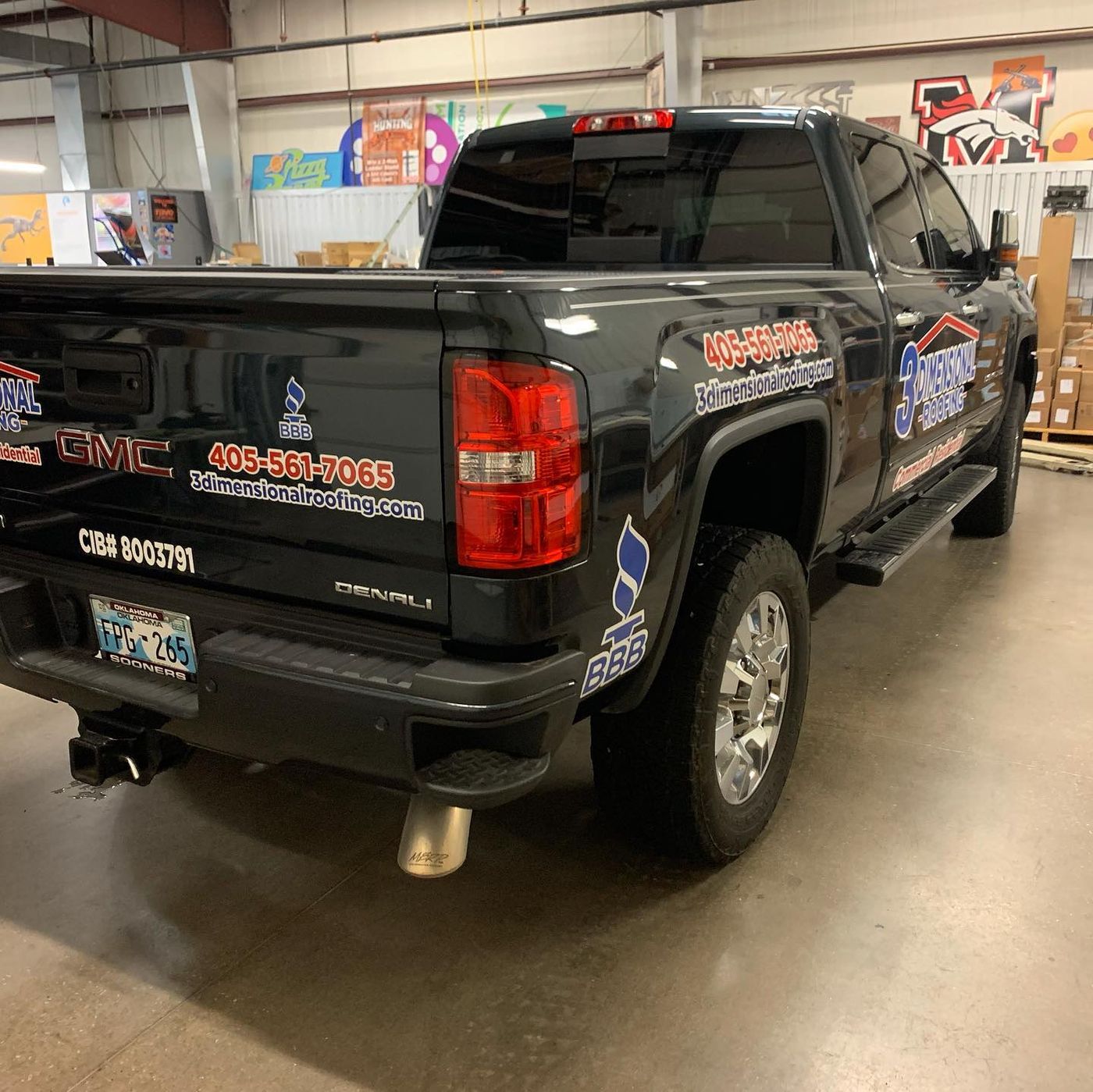 Door and tailgate graphics on a black pickup