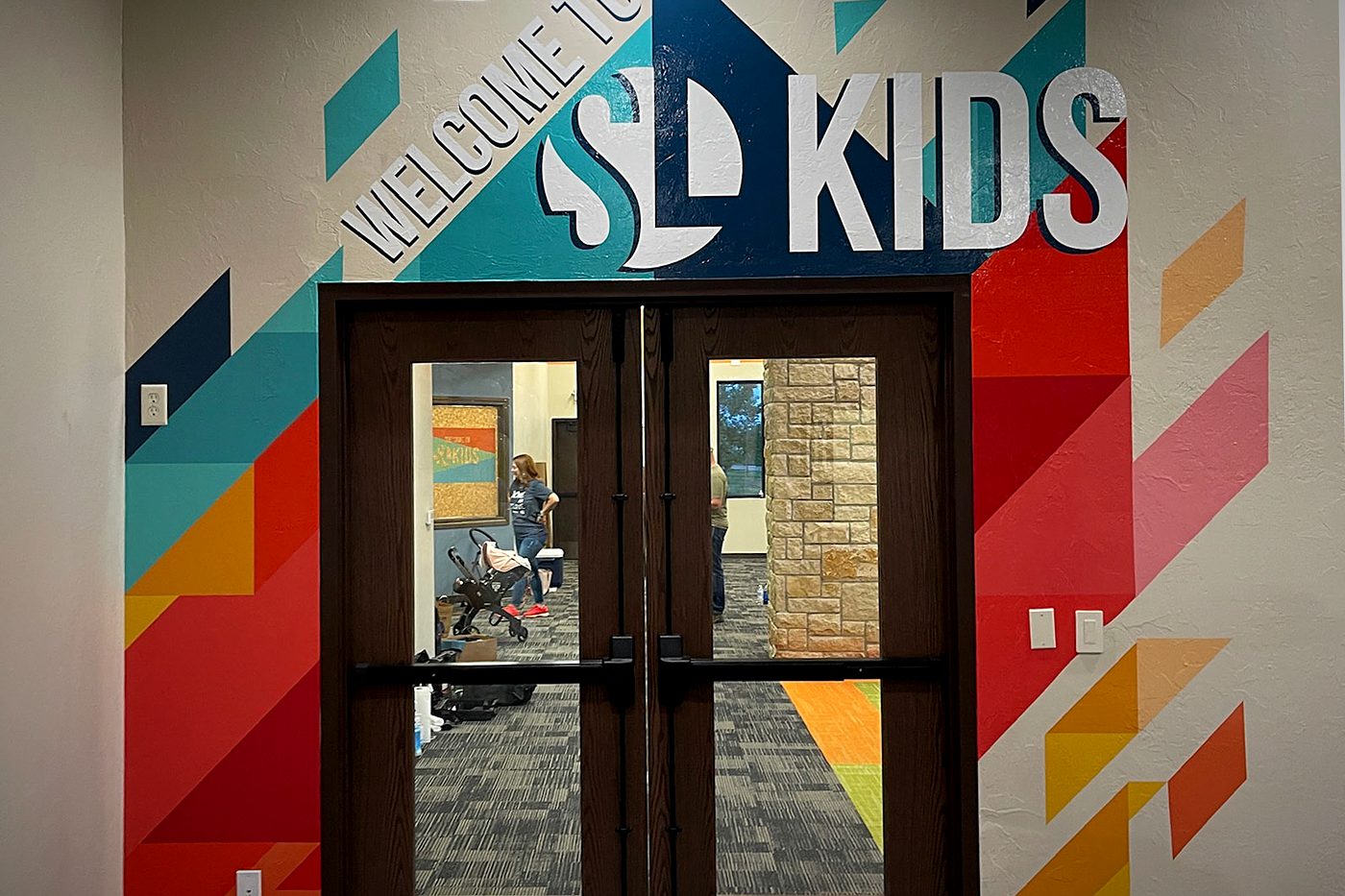 Welcome to SL Kids geometric wall wrap around double doors