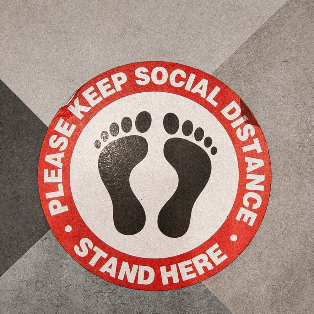 Round stand-here floor decal with footprints