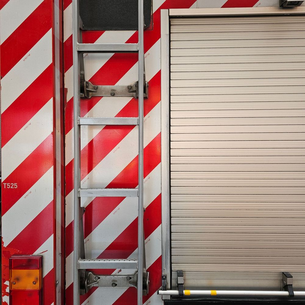 Red and white reflective chevrons on a fire truck