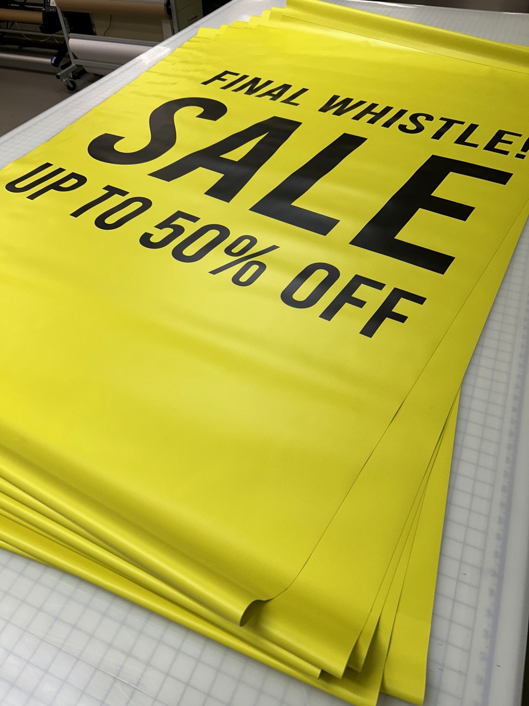 Bright yellow promotional sale banners in production