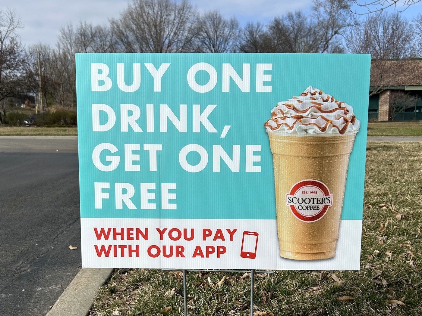 Full-color promotional yard sign installed outdoors
